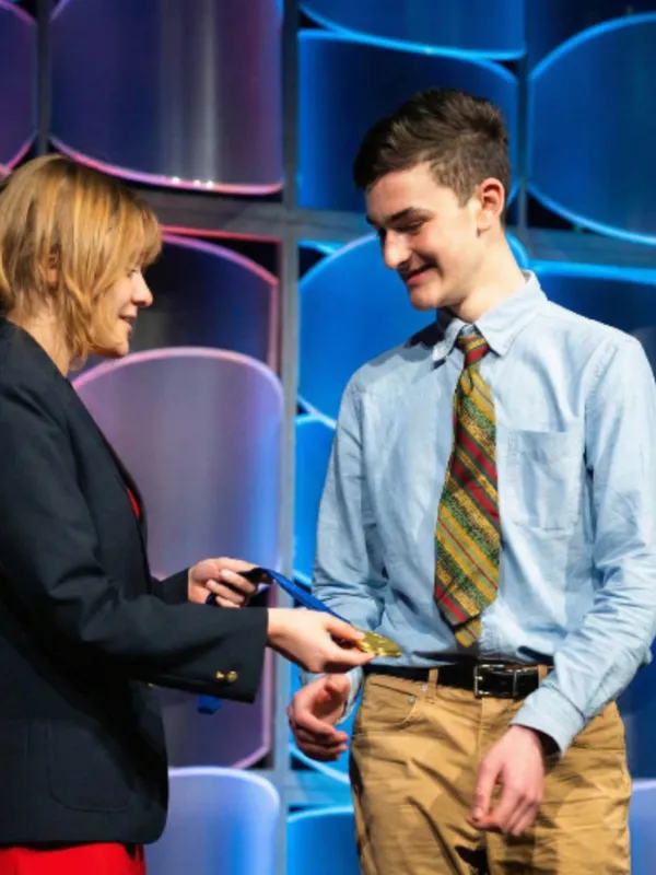 Evan Tanner on stage at the 2024 Business Professionals of America Web Design contest accepting the state title.
